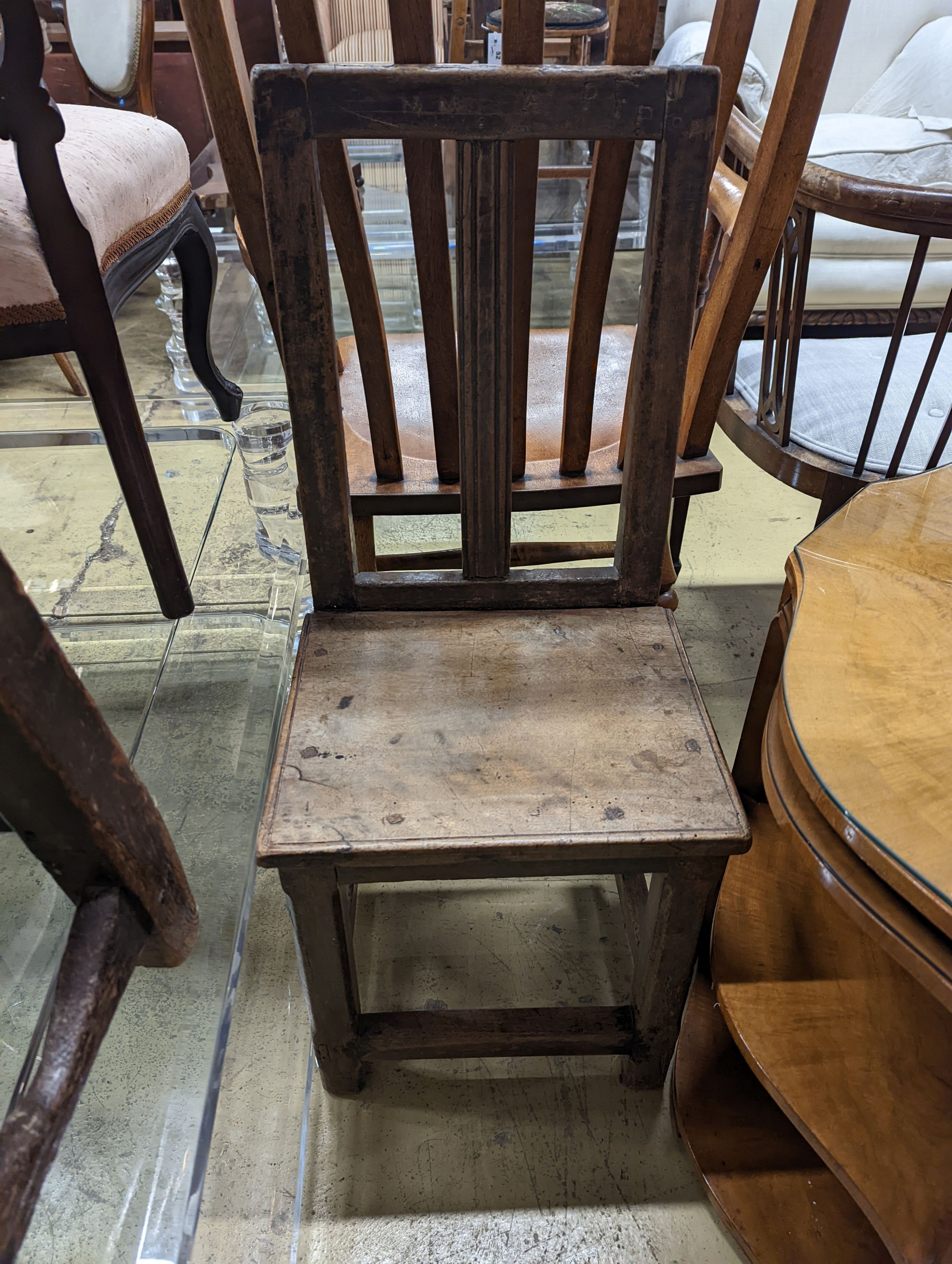 Two antique walnut or pine backstools.